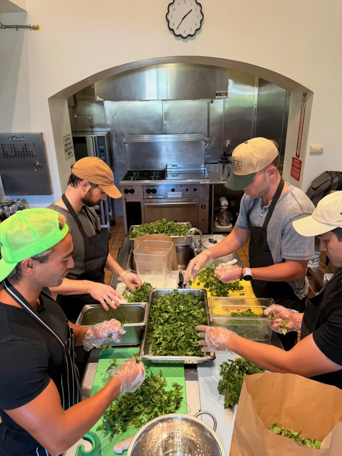 Volunteers on the assembly line plating meals