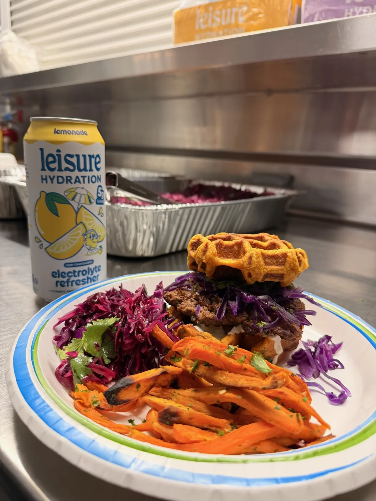 Close-up of a single sweet potato waffle-bun burger with chimichurri and aioli