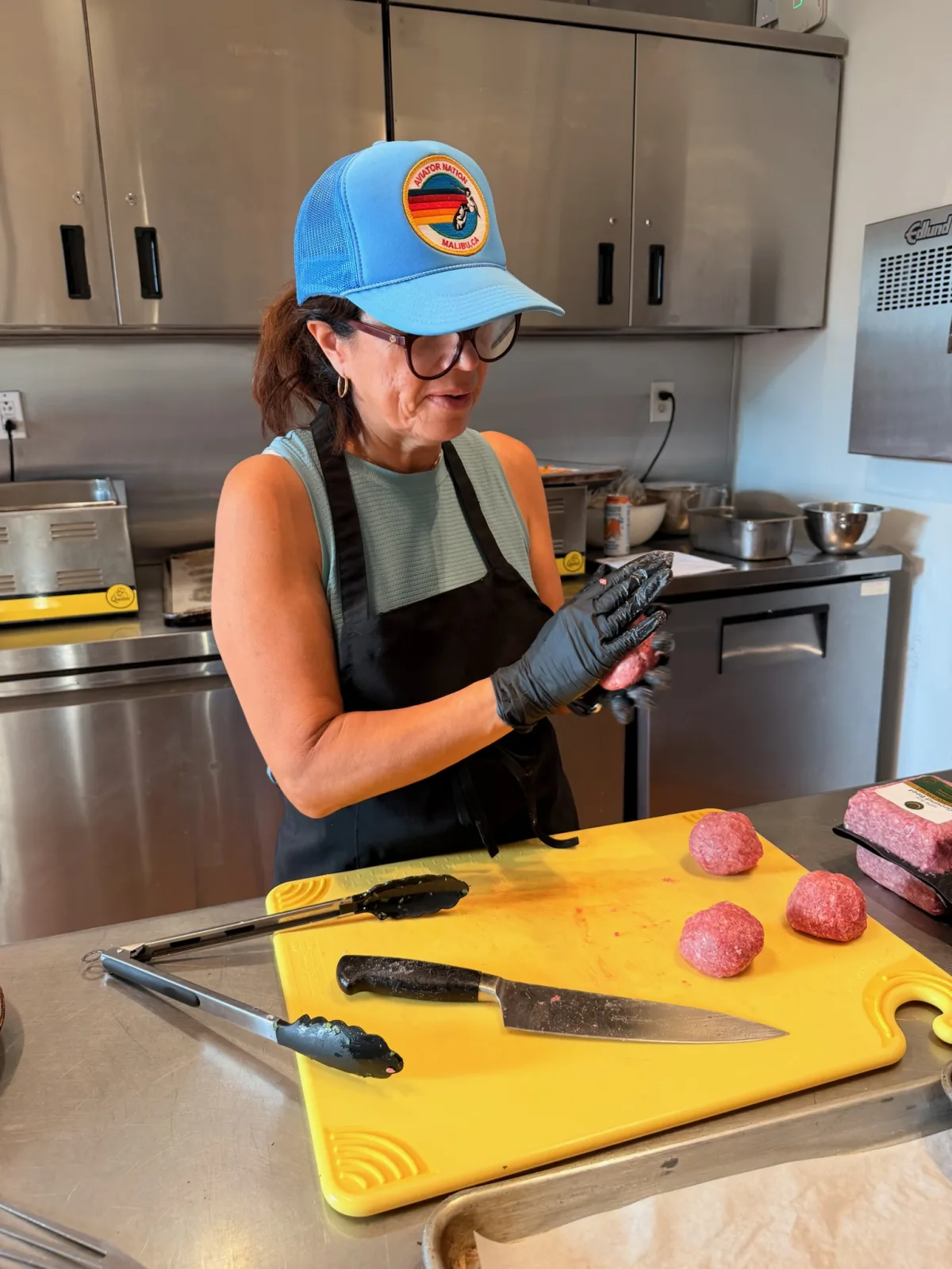A Seed to Serve LA volunteer forming grass-fed beef into smashed patties